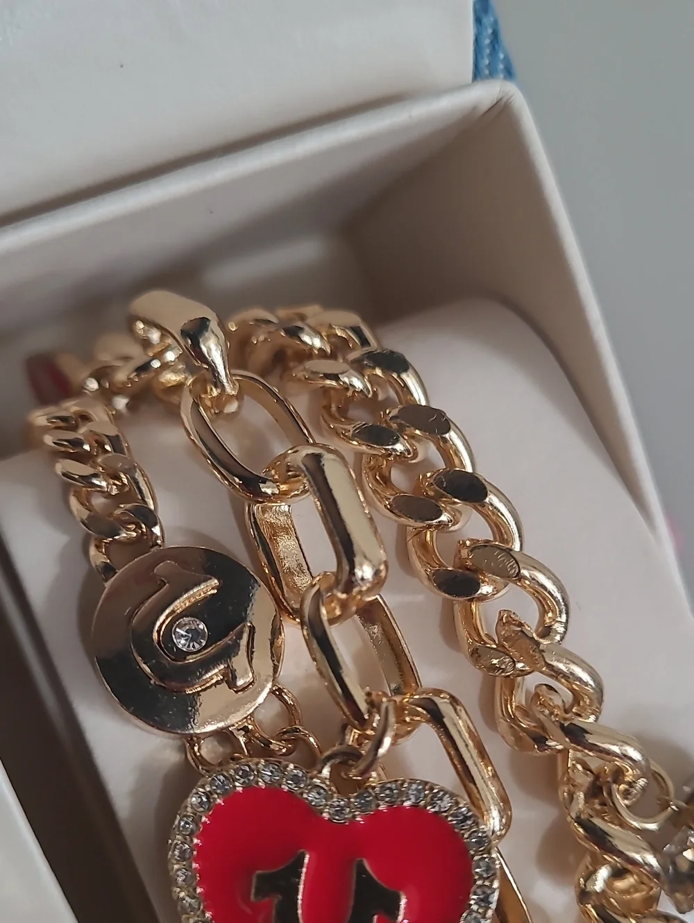 True Religion Gold-Tone Watch with Black Dial and Charm Bracelet